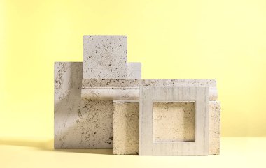 Abstract modern still life. Natural materials. Composition of travertine and concrete blocks.