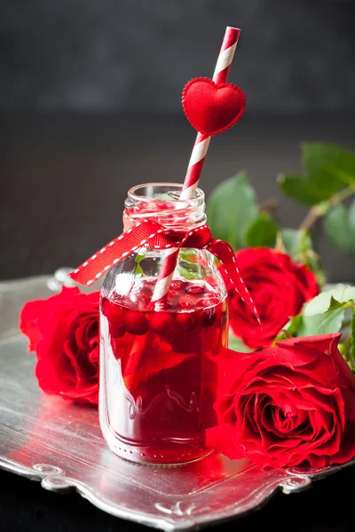 Small bottle with cranberry cocktail — Stock Photo, Image