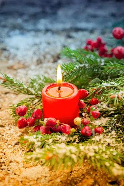 Fir branches,candle and berries — Stock Photo, Image