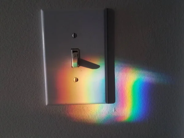 Red Blue Rainbow Spectrum Colors Projected Wall Light Switch — Stock Photo, Image