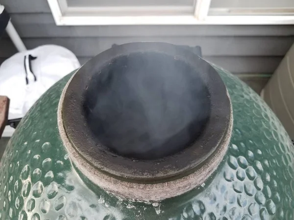 Smoke rising from big green metal barbecue grill — Stock Photo, Image