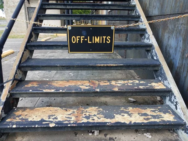 off limits sign on worn stairs or steps