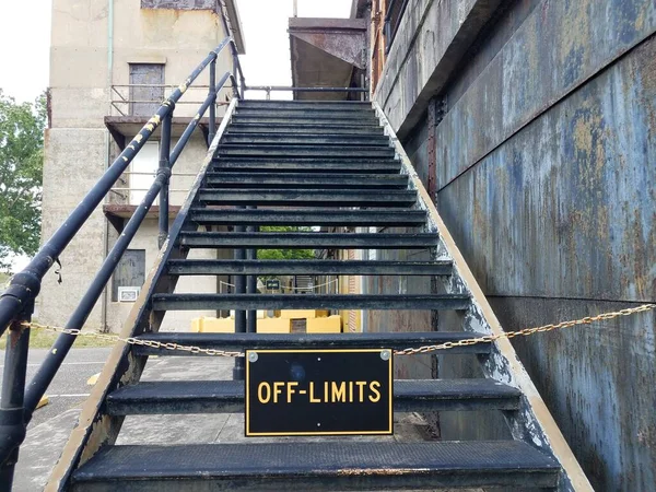 off limits sign on worn stairs or steps