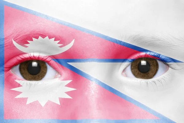 人間のネパールの旗と顔 — ストック写真