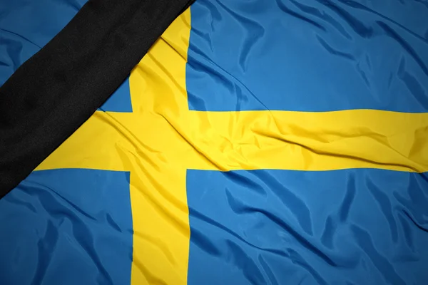 National flag of sweden with black mourning ribbon — Stock Photo, Image