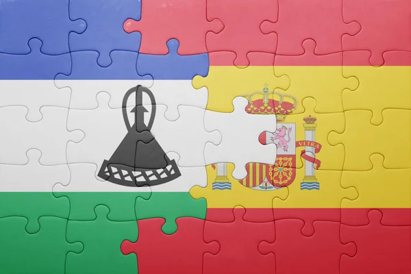 Puzzle with the national flag of spain and lesotho — Stock Photo, Image