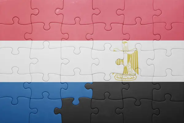 Puzzle s národní vlajkou Nizozemska a egypt — Stock fotografie