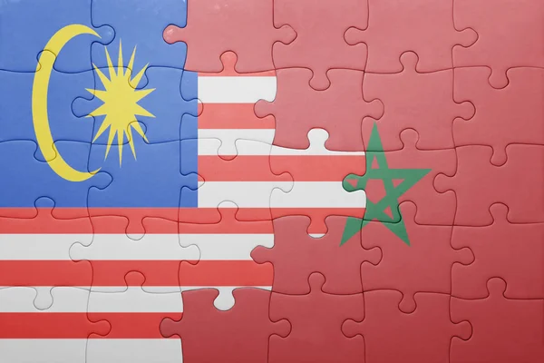 Puzzle with the national flag of morocco and malaysia . — Stock Photo, Image