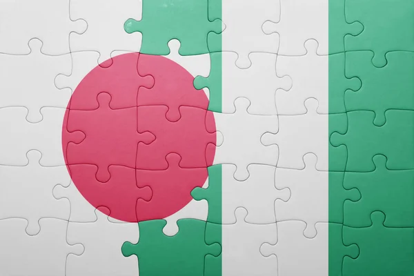 Puzzle with the national flag of japan and nigeria — Stock Photo, Image