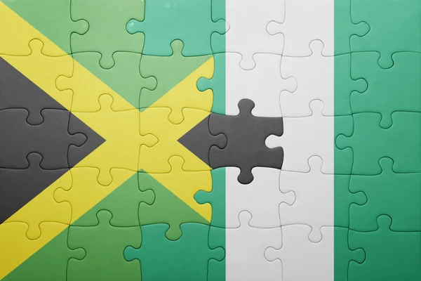 Rompecabezas con la bandera nacional de jamaica y nigeria — Foto de Stock