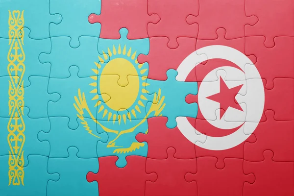 Quebra-cabeça com a bandeira nacional da tunisia e do Cazaquistão — Fotografia de Stock
