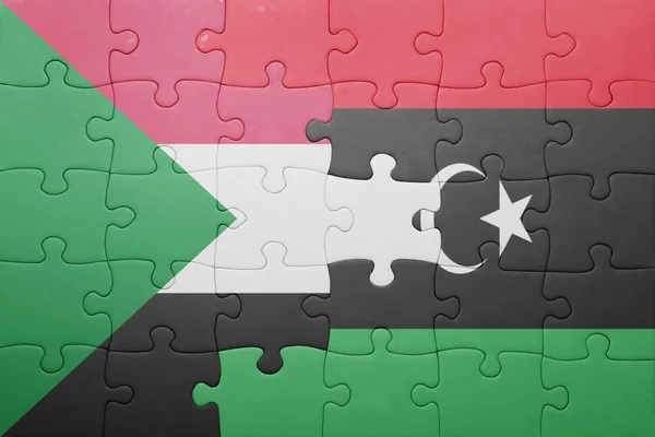 Rompecabezas con la bandera nacional de sudan y libya —  Fotos de Stock