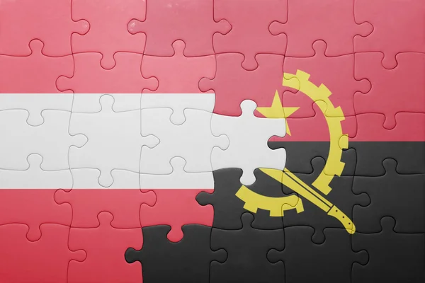 Puzzle s národní vlajkou Angoly a Rakousko — Stock fotografie