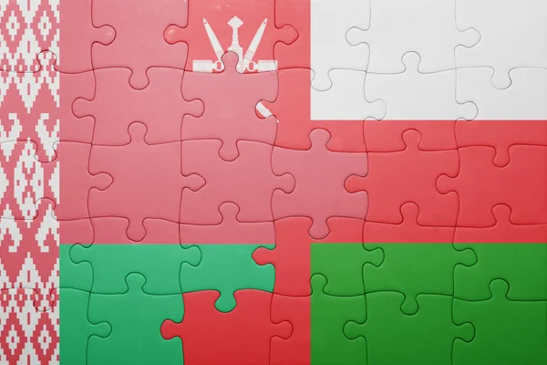 Puzzel met de nationale vlag van Wit-Rusland en oman — Stockfoto