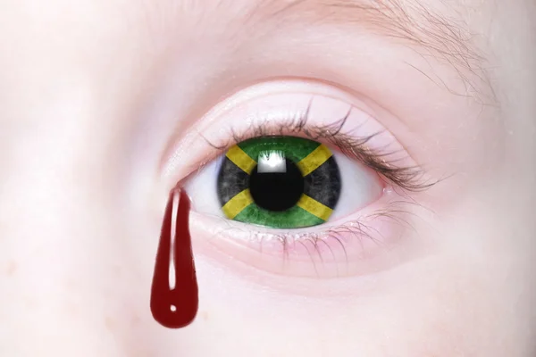 Ojo humano con bandera nacional de jamaica — Foto de Stock