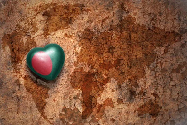 Heart with national flag of bangladesh on a vintage world map crack paper background. — Stock Photo, Image