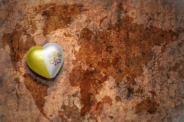 Heart with national flag of vatican city on a vintage world map crack paper background. concept — Stock Photo, Image