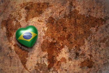 heart with national flag of brazil on a vintage world map crack paper background. concept clipart