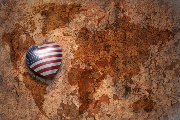 Heart with national flag of united states of america on a vintage world map crack paper background. concept — Stock Photo, Image