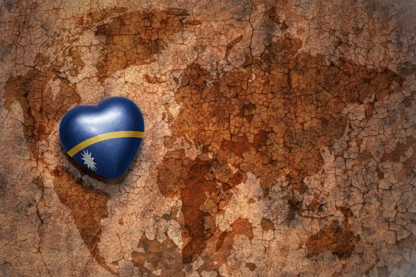 Heart with national flag of Nauru on a vintage world map crack paper background. concept — Stock Photo, Image
