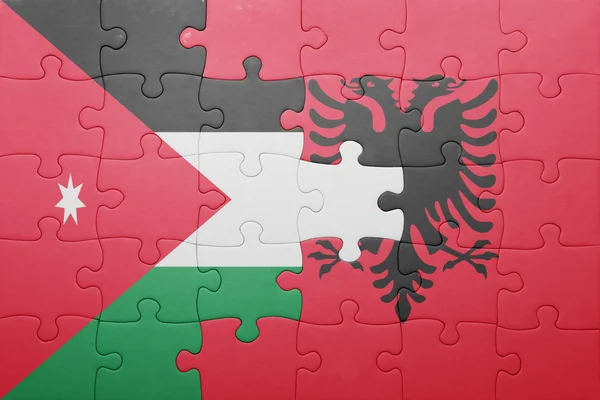 Rompecabezas con la bandera nacional de Jordania y Albania — Foto de Stock