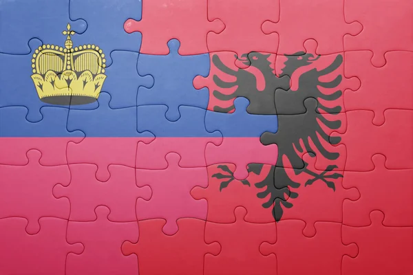 Puzzle s národní vlajkou Lichtenštejnska a Albánie — Stock fotografie