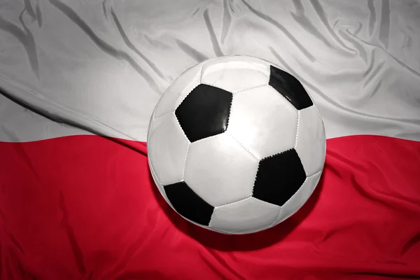 Zwartwit Voetbal bal op de nationale vlag van Polen — Stockfoto