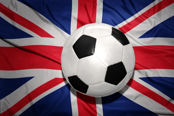 Black and white football ball on the national flag of great britain — Stock Photo, Image