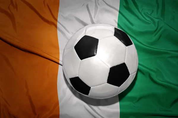 Black and white football ball on the national flag of cote divoire — Stock Photo, Image