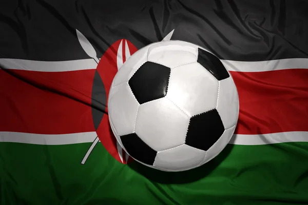 Černobílý fotbalový míč na národní vlajce Keni — Stock fotografie