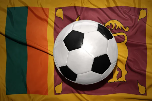 Black and white football ball on the national flag of sri lanka — Stock Photo, Image