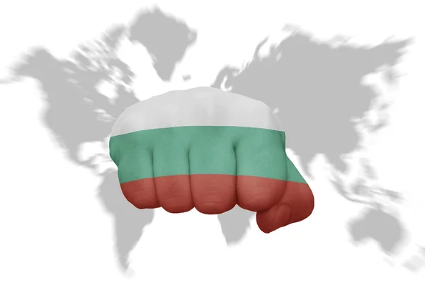 Fist with the national flag of bulgaria on a world map background — Stock Photo, Image