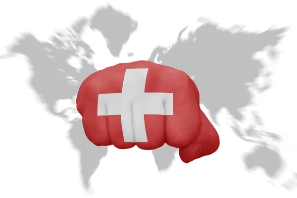 Fist with the national flag of switzerland on a world map background — Stock Photo, Image