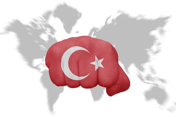 Fist with the national flag of turkey on a world map background — Stock Photo, Image
