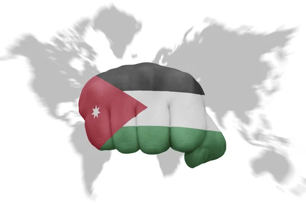 Fist with the national flag of jordan on a world map background — Stock Photo, Image