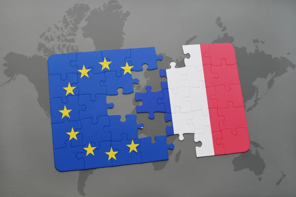 Puzzle with the national flag of france and european union on a world map background. — Stock Photo, Image