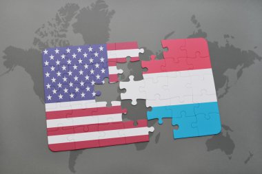 Amerika Birleşik Devletleri ve Lüksemburg ulusal bayrak dünya harita arka plan üzerinde ile bulmaca