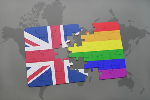 Puzzle with the national flag of great britain and gay rainbow flag on a world map background — Stock Photo, Image