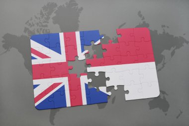 bir dünya haritası arka plan üzerinde büyük Britanya ve Endonezya ulusal bayrağı ile bulmaca.