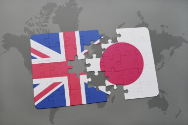 bir dünya haritası arka plan üzerinde büyük Britanya ve Japonya'nın ulusal bayrağı ile bulmaca.