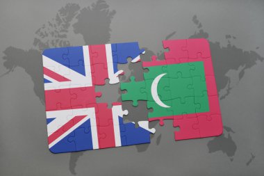 bir dünya haritası arka plan üzerinde büyük Britanya ve Maldivler ulusal bayrağı ile bulmaca.