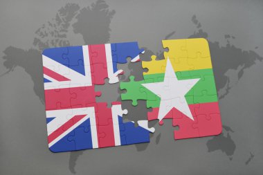 bir dünya haritası arka plan üzerinde büyük Britanya ve Myanmar ulusal bayrağı ile bulmaca.