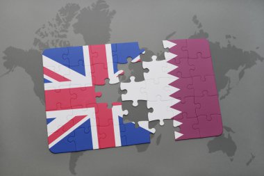 bir dünya haritası arka plan üzerinde Büyük Britanya ve Katar ulusal bayrağı ile bulmaca.