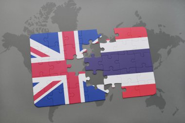 bir dünya haritası arka plan üzerinde büyük Britanya ve Tayland ulusal bayrağı ile bulmaca.
