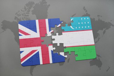 bir dünya haritası arka plan üzerinde büyük Britanya ve Özbekistan ulusal bayrağı ile bulmaca.
