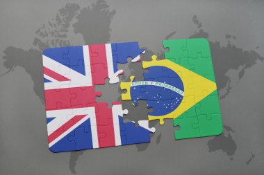 bir dünya haritası arka plan üzerinde büyük Britanya ve Brezilya ulusal bayrağı ile bulmaca.
