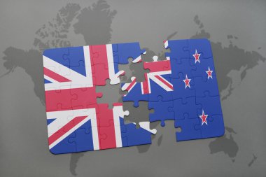 Büyük Britanya ve Yeni Zelanda ulusal bayrak dünya harita arka plan üzerinde ile bulmaca.