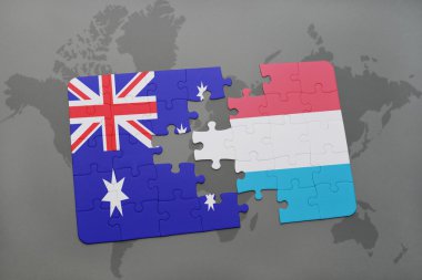 Avustralya ve Lüksemburg ulusal bayrak dünya harita arka plan üzerinde ile bulmaca.