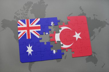 Avustralya ve Türkiye'nin dünya harita arka plan üzerinde bayrağı ile bulmaca.