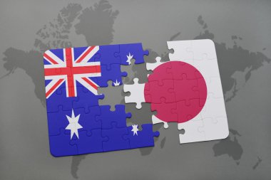 bir dünya haritası arka plan üzerinde Avustralya ve Japonya ulusal bayrağı ile bulmaca.